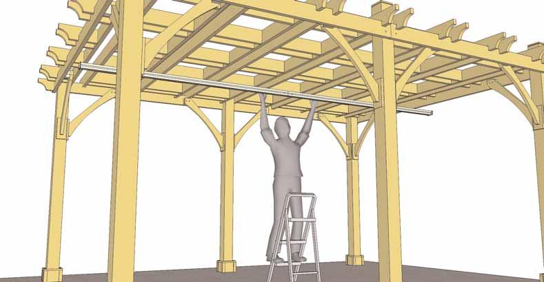 3. With Step Ladders and another helper, lift up the Drive Beam and center on Girders.