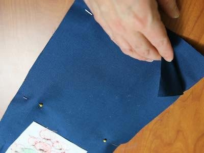 Lay the embroidered front piece on top of another piece of lightweight canvas, right sides