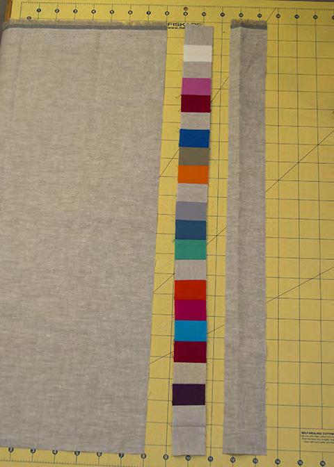 Add borders as desired to pixel block from various strips of fabric to bring pillow to 21. Consider piecing a 1-1/2 strip with a few extra 1-1/2 squares as shown in the example.