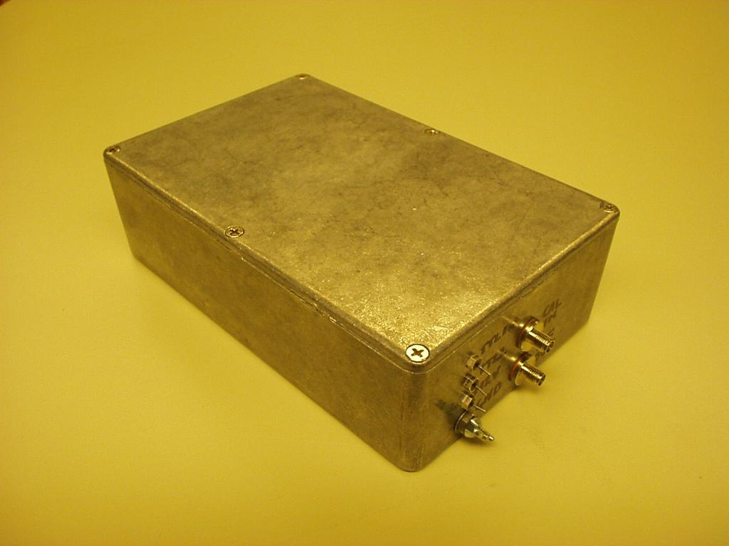 Figure 1: External view of front end box. the RF switch in the upper right. The switch connects either this input or a 50Ω terminator to a 20 db directional coupler.