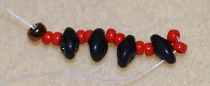 Begin with a stop bead, leaving a 12 tail (we will use this tail to attach the clasp later) 2.