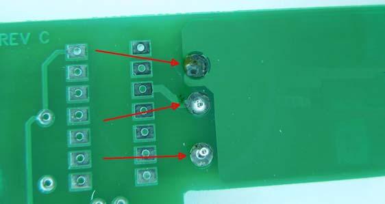 Cut a ½ inch piece of resistor lead off of two resistors in the kit and insert the leads in the holes as shown below.