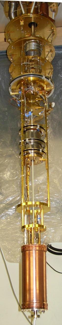 Bottom left is a photo of the copper-coated, stainless steel resonant microwave cavity with tuning rod inside.