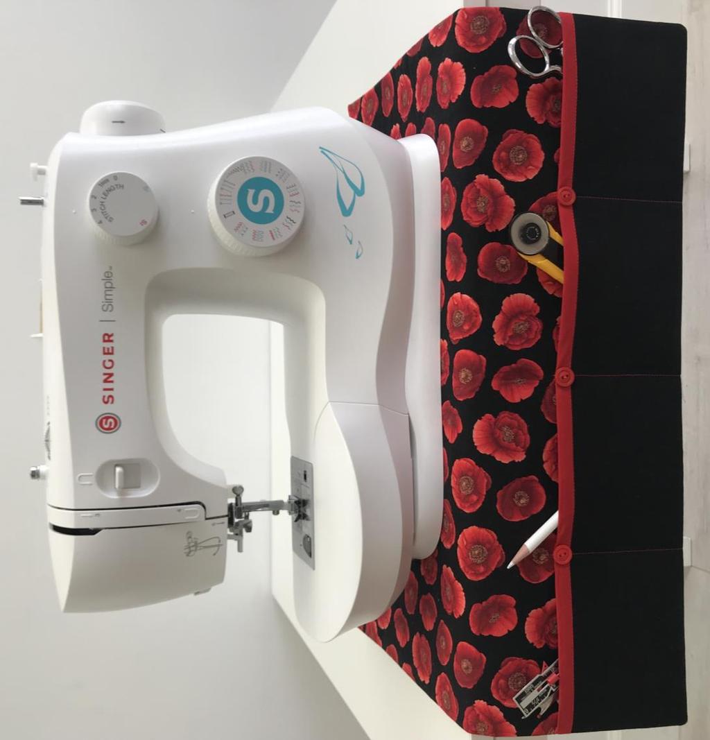 SINGER PROJECTS Sewing Machine Mat with Pockets This handy sewing machine mat with pockets not only helps protect your table surface, it keeps your go-to notions right at your fingertips.