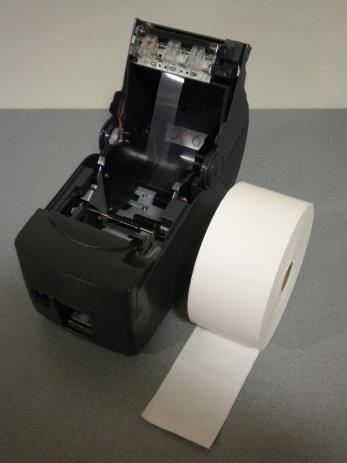 Lift up on the release lever located on the right corner of the printer to pop open the