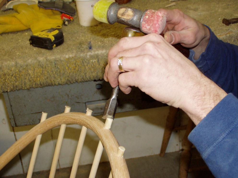 Installing, Pegging, and Wedging the Bow Using a chisel that is wider than the spindles, split the spindles perpendicularly to the grain of the wood in the bow.