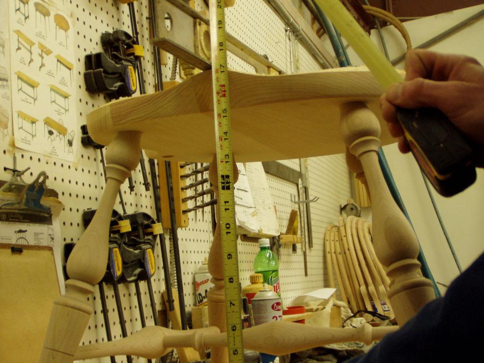 Keep the level on the chair front to back and measure from the bench to the bottom of the level.