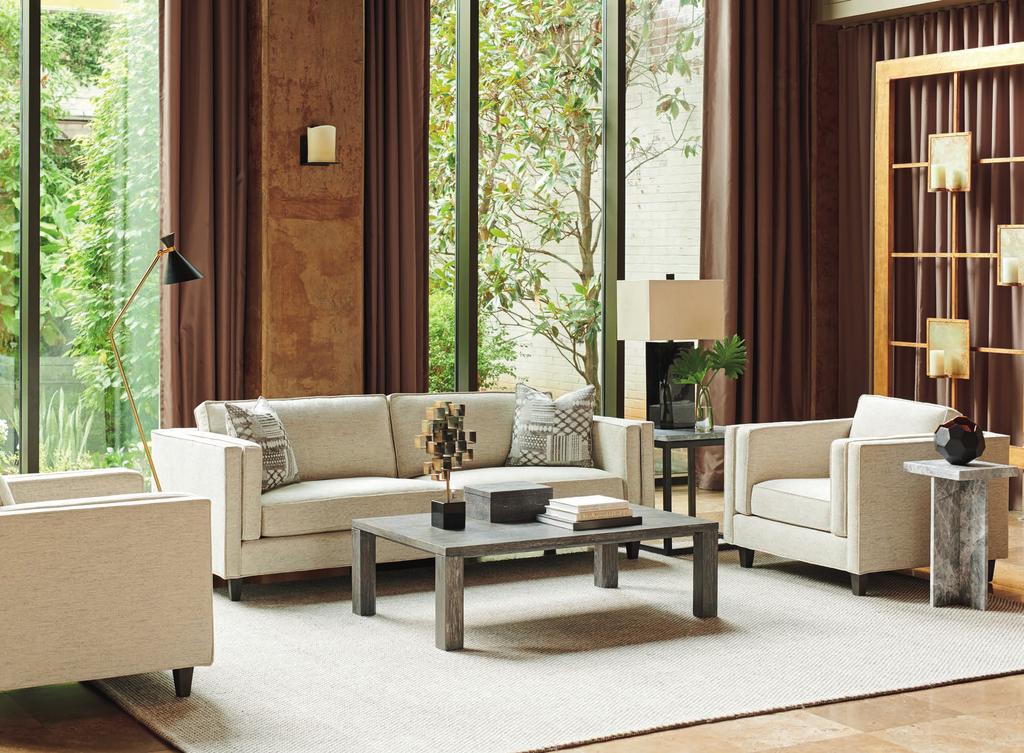 The Brenner upholstery series, comprised of sofa, chair and ottoman, is shown here in the light taupe correlation. The accent pillows are standard with the sofa.