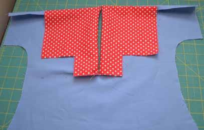 Fold collar facing over towards the right side (front) of the