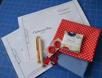 1/2 yard Bella solids (Betty Blue) 1 fat quarter coordinating dot (Dottie Small Dots Red) Remnant of muslin or matching fabric 9 x 21" Clothespin Bag