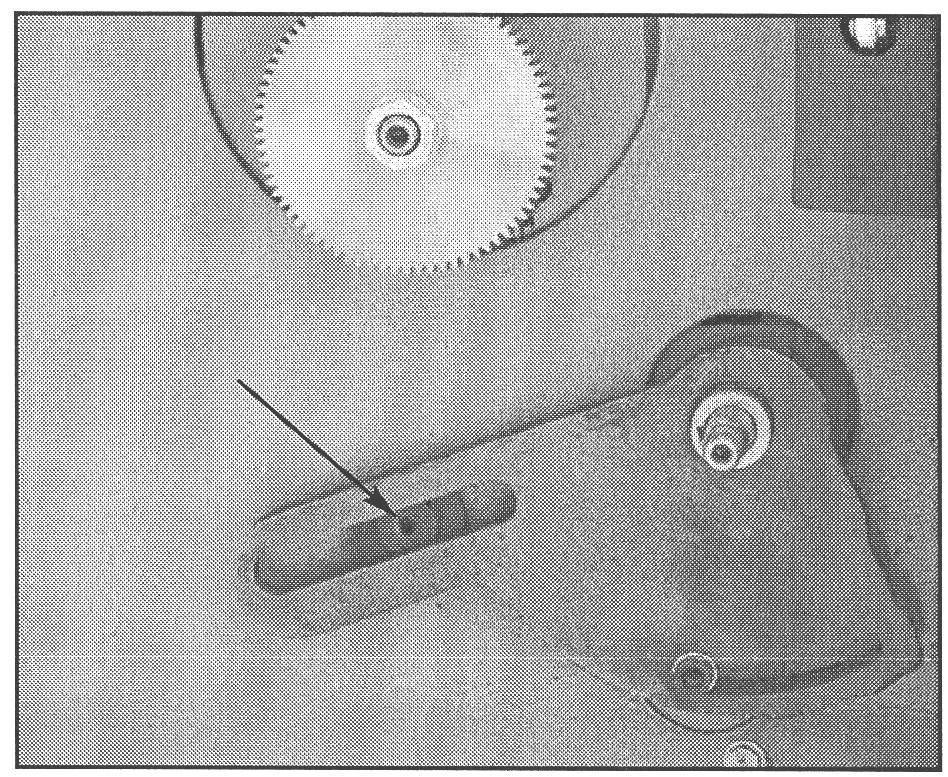 The number of teeth are stamped on each gear. To begin: 1. Unplug the machine. 2. Remove the nuts on the end of the shafts for gears A and D. Figure 41. Swing gears in lower position. 3.