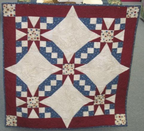 It is a beautiful block and would be wonderful in various color combinations. The sample is done using patriotic fabrics. Quilt measures 32 square.