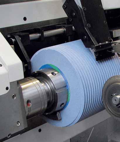 Dressing for flexible efficiency via standard dressing rolls The dressing unit consists of a diamond dressing roll mounted on a dedicated spindle, which is located on the rotating table structure.