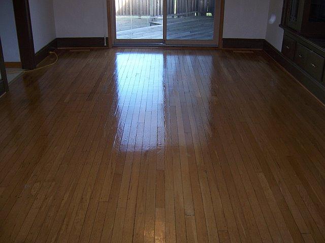THEN, THE FLOOR IS BUFFED AND THOROUGHLY VACUUMED AND THEN FINISHED WITH TWO TO THREE COATS DUE TO