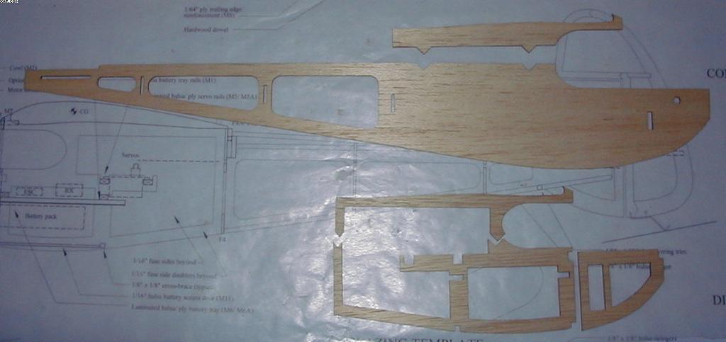 Remove the rudder from the plan and sand all edges to a rounded profile. The rudder will be hinged to the vertical stabilizer pieces by taping it into place after the parts are covered.