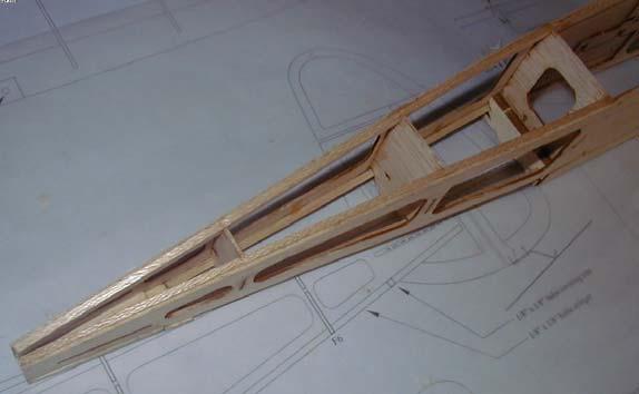 Cut 2 stringers for the bottom of the fuselage (running front to back from F4 to the tip of the tail) from the 1/8 x 1/8