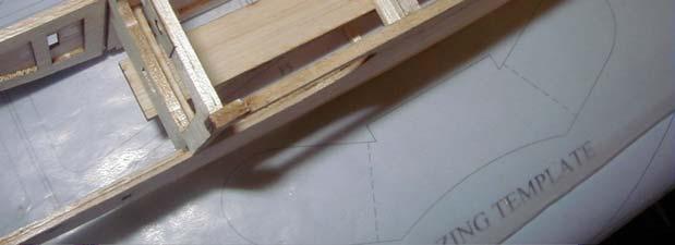 Cut another cross brace for the bottom of the fuselage (goes in the slots under F3) from the 1/8 x 1/8 balsa material and