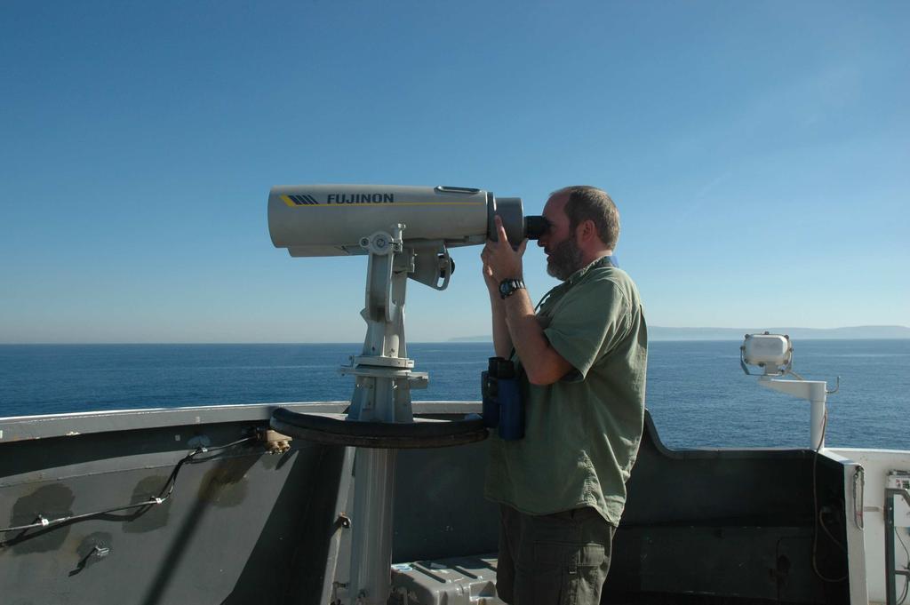 Two trained marine mammal observers on port and starboard, scanning