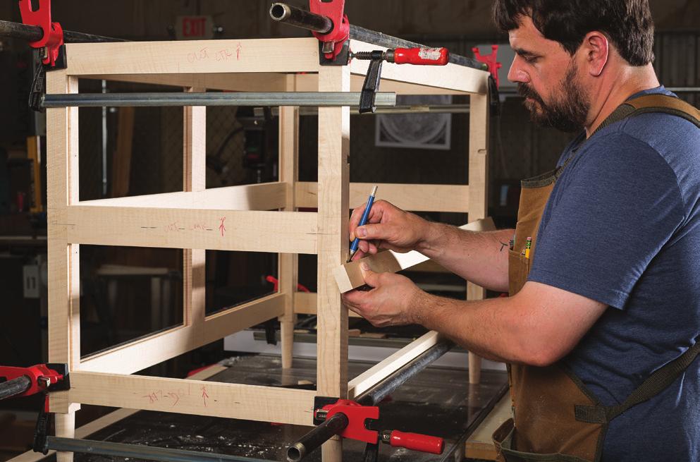 Dovetails, lap joints, and drawer supports make dividers tricky The divider assembly completes the outer frame of the case, and is connected to inner frames that support and guide the drawers.