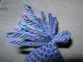 Pull the ends of the yarn through the loop with your
