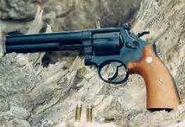 An elegant and very accurate way to fulfill the criteria is with a revolver chambered for the.32 S&W Long, shooting wadcutter loads.