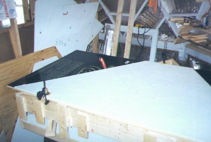An extension board is clamped at the bottom of the pattern to allow a continuous accurate straight cut.