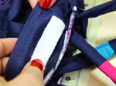 Stitching slightly to the left of the previous seam ensures that it will be completely covered when