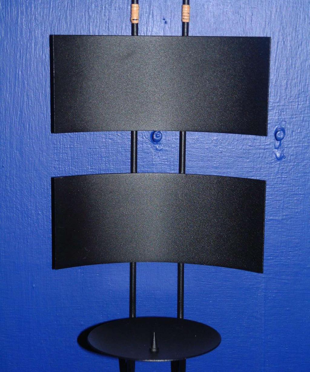 30 FJARRAN sconce FORMELL holder 29 A sconce made from black lacquered steel for thick cathedral candles.