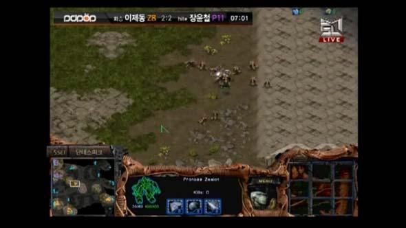 4 zealots move out. Jaedong has around 8 speed zerglings in the center of the map, which allows him to spot the zealots. He cannot directly engage them with his ling count.