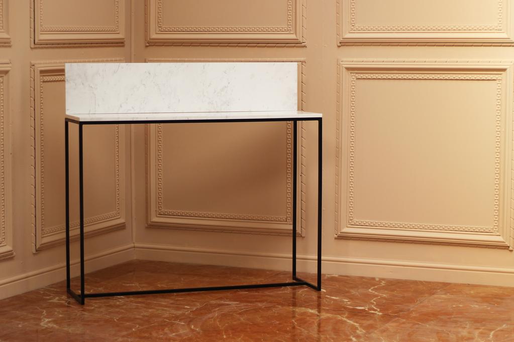 The marble top is made from two pieces of Volakas marble, joined together to form the L