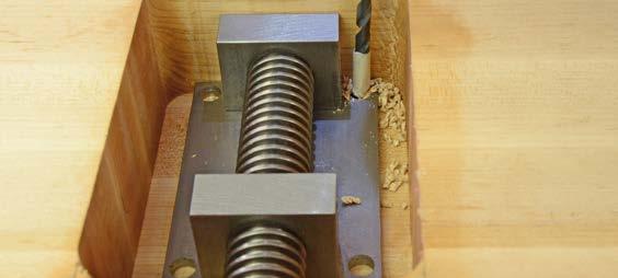 Use a large vise clamp to secure the vise jaw assembly to your bench top.