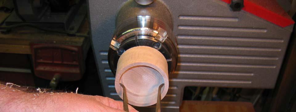 Use the inside calipers to determine if the lid flange is parallel. Insert the caliper up against the shoulder cut by the square scraper and spread open the tips until they just touch.