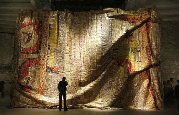 Anatsui has a group of workers in his studio continuously piecing together scrap metal with copper wire to create these majestic wall hangings.