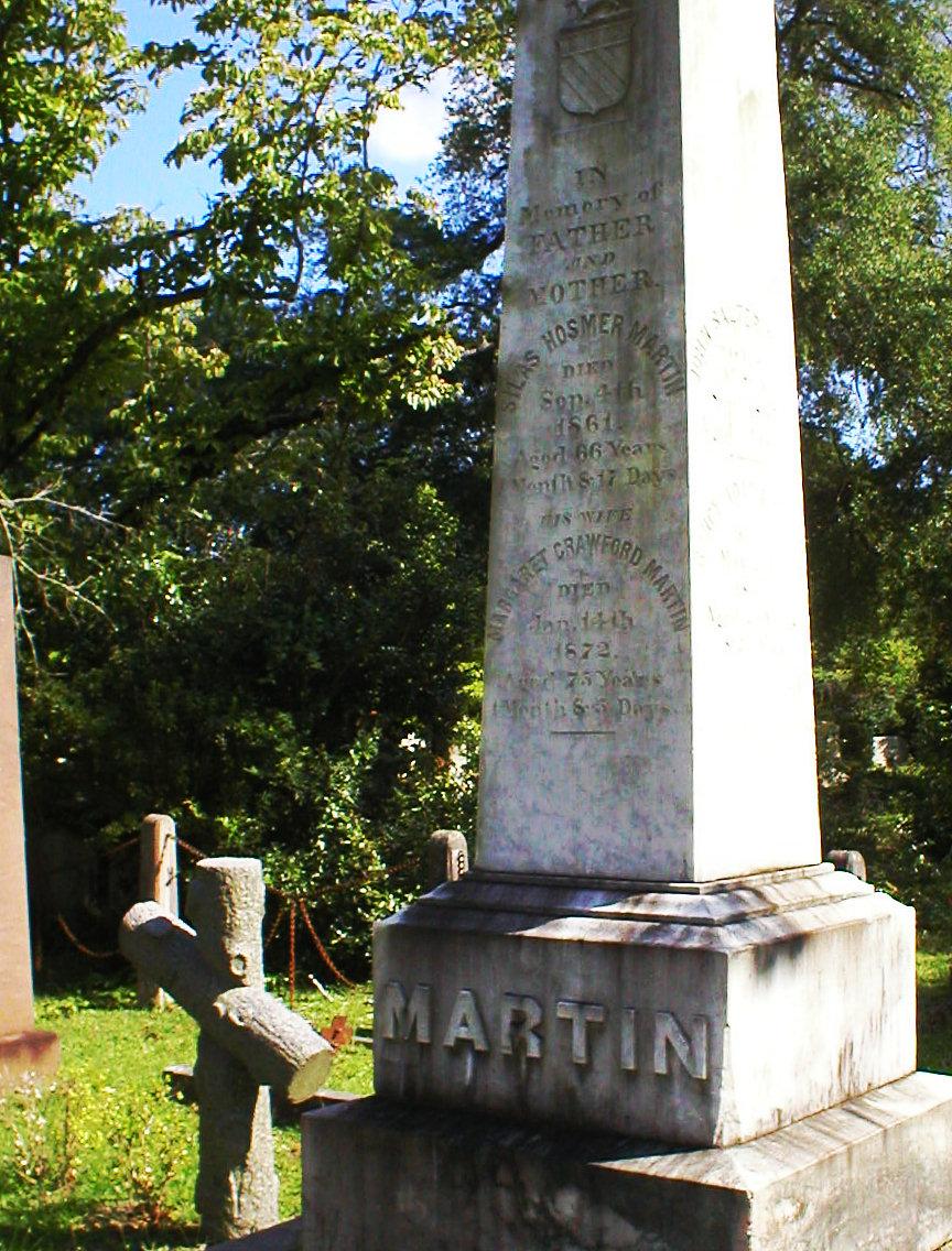 1.10 - THE GIRL BURIED IN A CASK OF SPIRITS AT OAKDALE CEMETERY The cross to the left of Martin has the single name Nance carved on it.