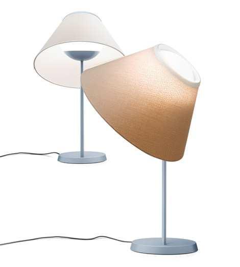 Cappuccina is a fixture composed of a slender base and a spherical luminous body in opal glass, containing an LED module, on which the fabric shade simply rests, without attachment: this