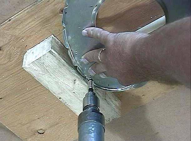 Keep the nose rib pressed tightly against the 2 x 4 block.