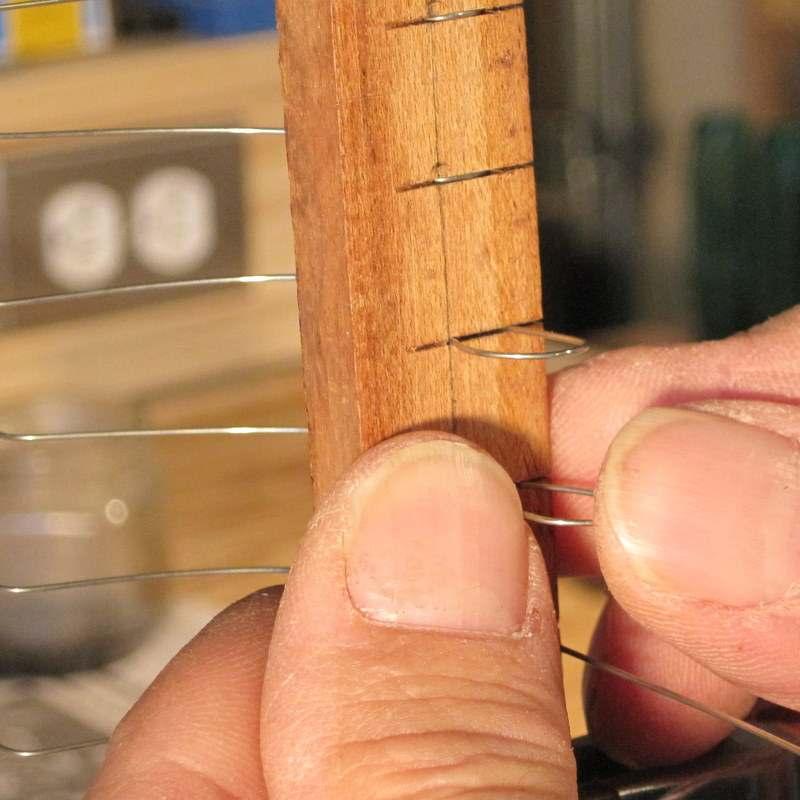 As long as at least one coil holding the coat hanger wire has been pulled tight, this technique will work.