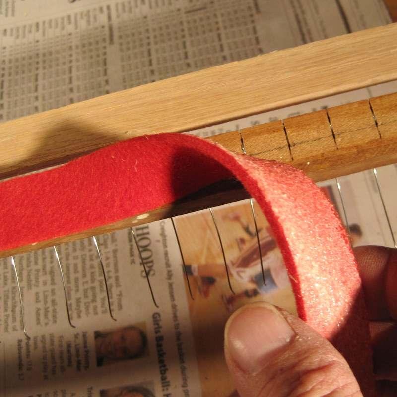 Step 35: Carefully stretch the spring rail felt on top of the rail itself.