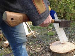 Making sure that you do not raise the chopping tool higher than the gloved hand which holds the wood,