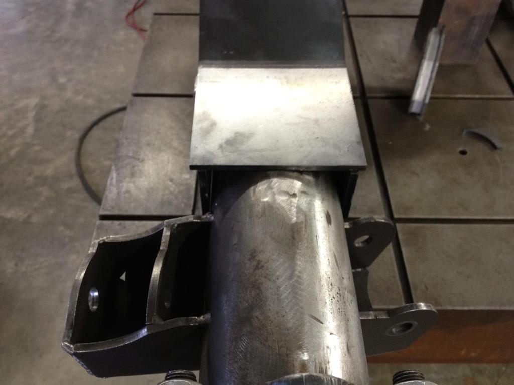 3.4) After the bracket assembly is trimmed and correctly positioned, install and tack weld the front plates, -03.