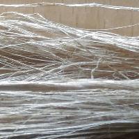 The fibers are then fed into the Dilo nonwoven plant consisting of opener, circular drums for carding and needle loom.