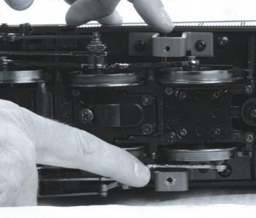 Insert the foam block between the trailing truck and the tender pilot as shown in Fig. 34. Figure 34 4.