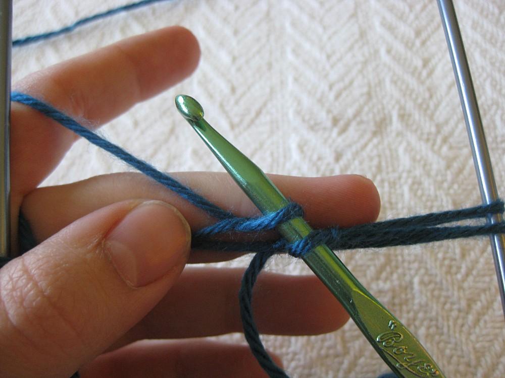 Insert your hook under the top loop on the left side (I use my left