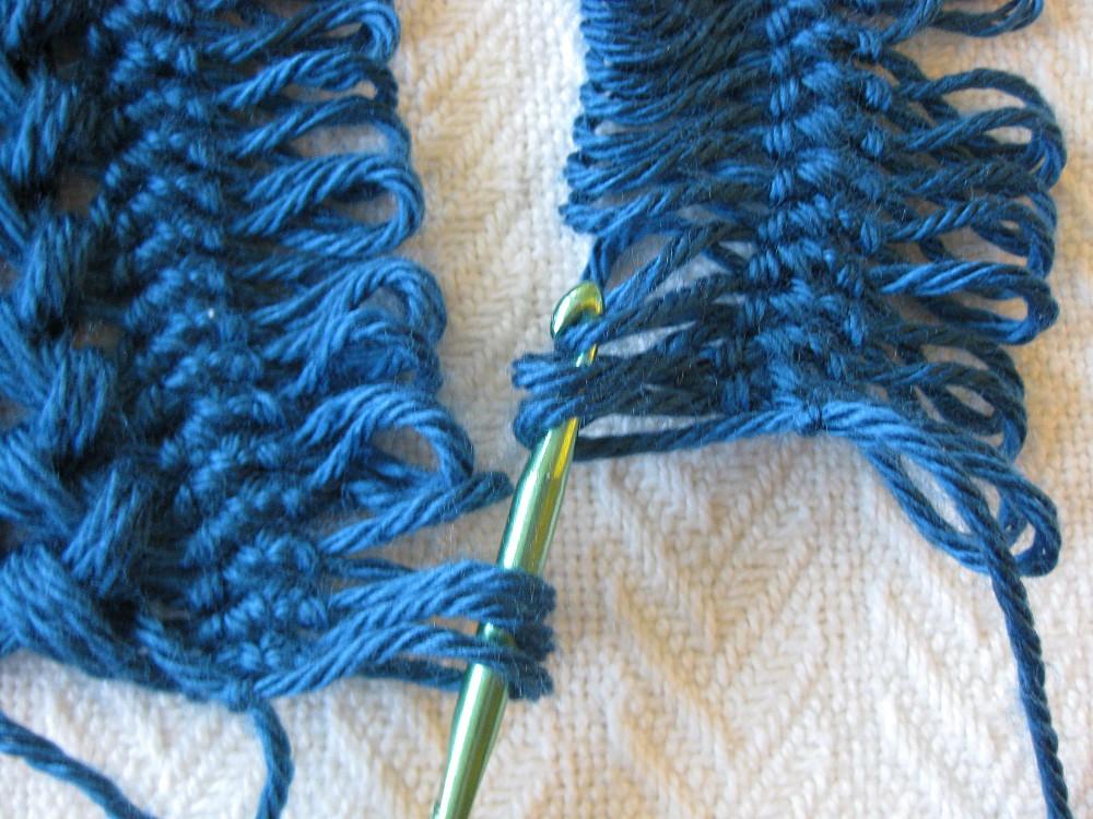 If I need to do this, I like to slide the rolled-up lace strip into the bottom part of the loom so it