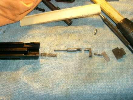 Now you can remove the firing pin and spring which you may have to push out the rear by sticking something like