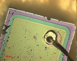 A visible light micrograph of a laser diode taken from a CD- ROM