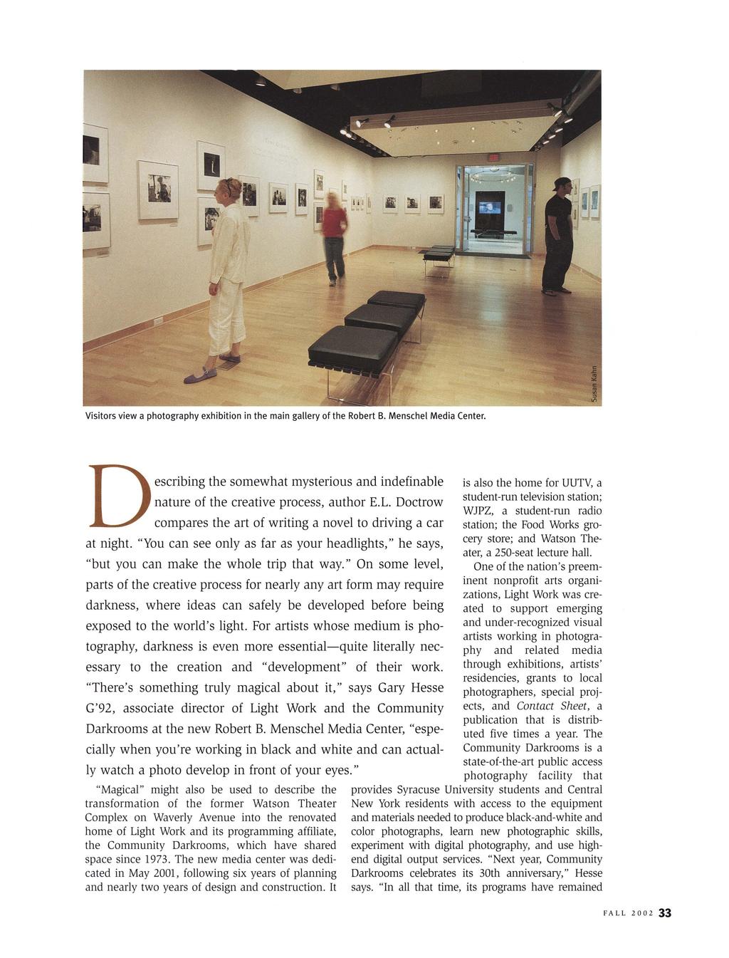 Syracuse University Magazine, Vol. 19, Iss. 3 [2002], Art. 9 Visitors view a photography exhibition in the main gallery of the Robert B. Menschel Media Center.