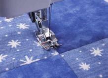 Quilting 2.2 Topstitching: Snap on the ¼ Right Guide Foot. Engage the IDT system. 5 Select a straight stitch, triple straight stitch or the hand-look straight stitch.