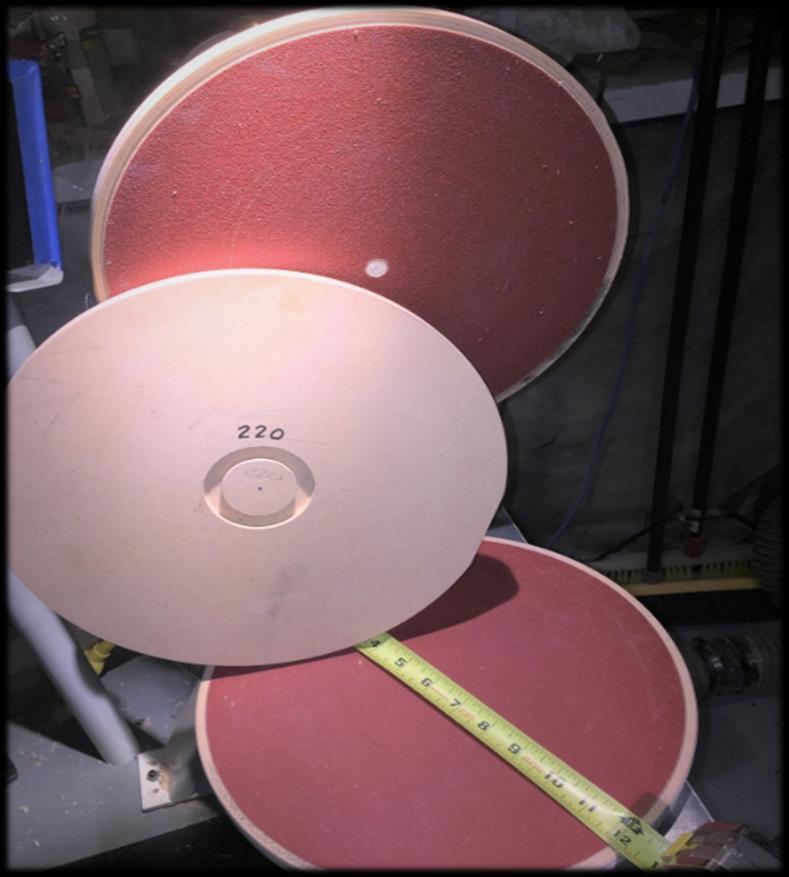 5. Sanding Disks Hardware Specialties sells 12 inch diameter, adhesive backed sanding disks. These can be put on particle board and used on your lathe.