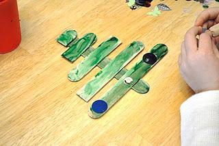 2) Paint with a brush or fingers or color each stick green. Allow to dry.